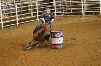 Our oldest daughter running her daughter's  backup horse.   Turn-&-Burn